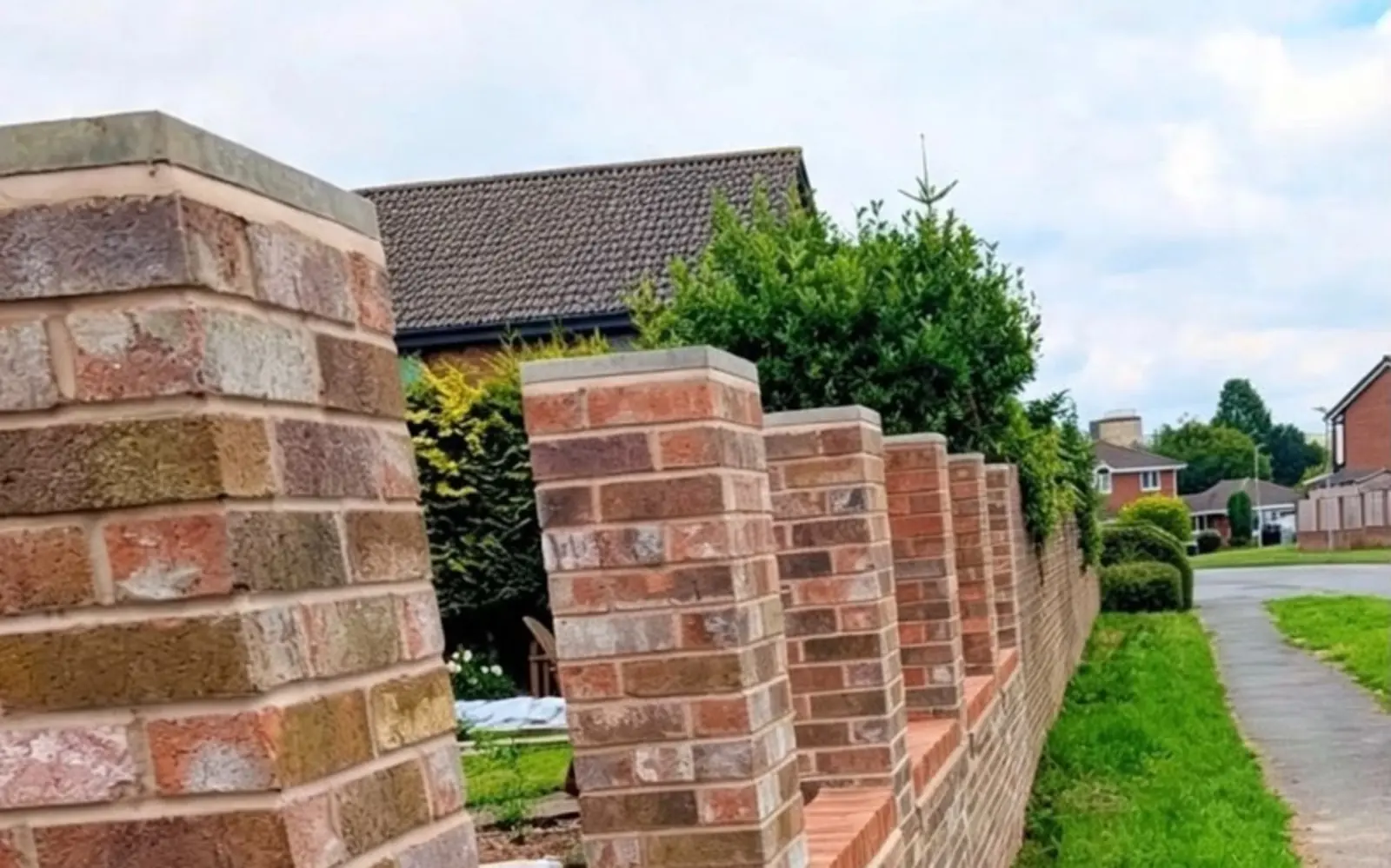 New brick boundary wall and pillars built by Talbots